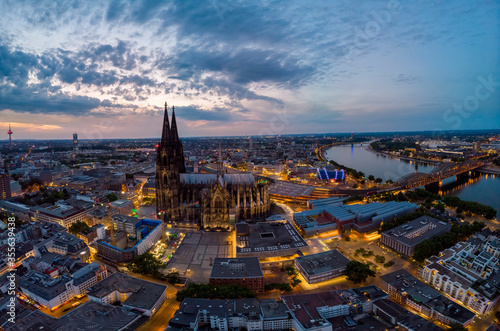 Colgne Koln Cathedral during sunset , drone aerial vie over Cologne and the river rhein during sunset in Germany Europe dusk photo