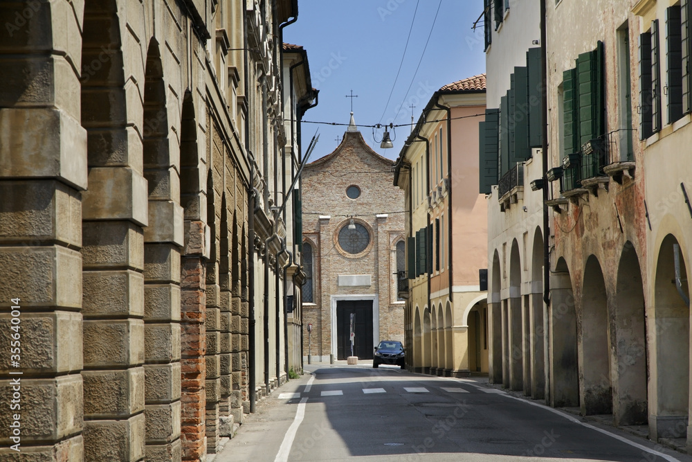 Via Carlo Alberto and church of Santa Maria Maggiore in Treviso. Veneto region. Italy