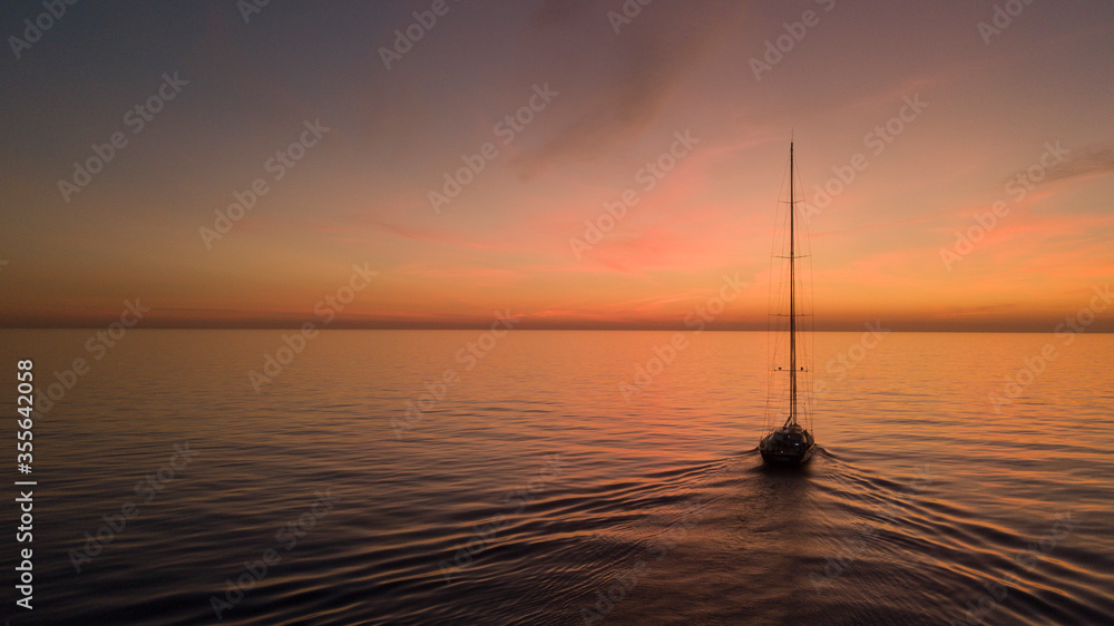 Superyacht sailing boat sunset over the sea 2 Superyacht sailing boat sunset over the sea 2
