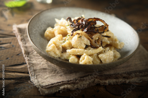 Traditional German noodles with cheese and fried onion