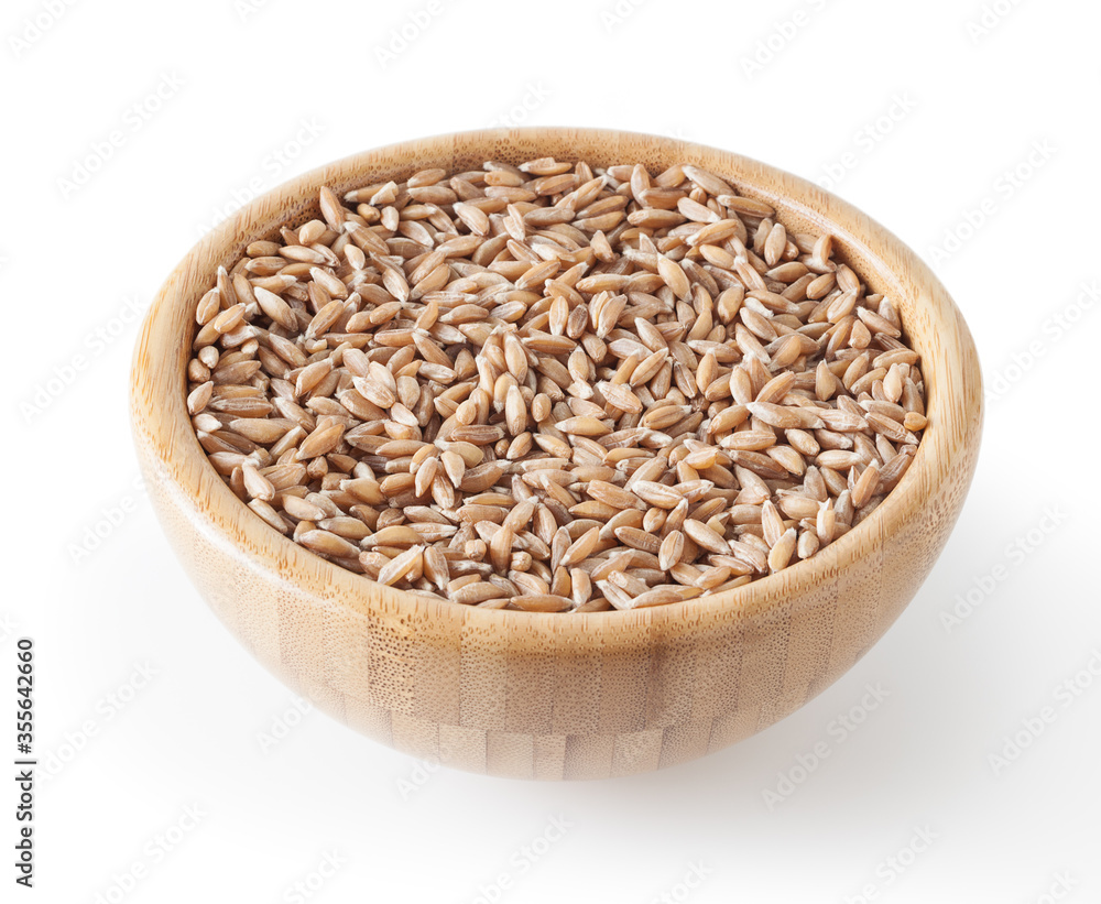 Grains of spelt in wooden bowl isolated on white background wiht clipping path Grains of spelt in wooden bowl isolated on white background wiht clipping path