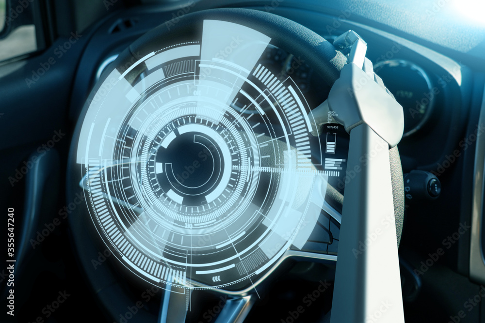 Robot arm on a steering wheel. Artificial intelligence drives a car. Autonomous vehicle concept. Robot arm on a steering wheel. Artificial intelligence drives a car. Autonomous vehicle concept.