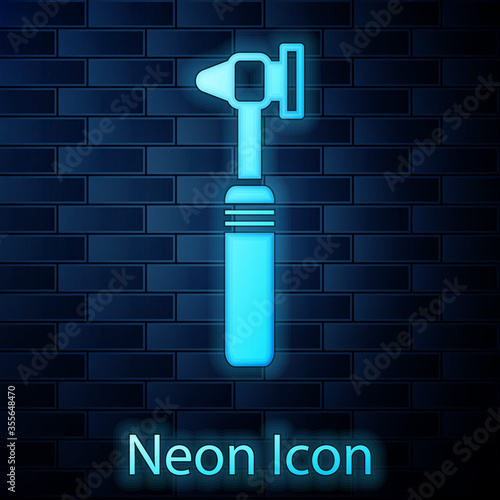 Glowing neon Medical otoscope tool icon isolated on brick wall background. Medical instrument. Vector Illustration.