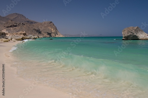 The beautiful beaches of Fazayah, without tourists above the scenic rocky mountain range, are located 60 miles south of Salalah. Arabian sea. Oman, Asia © Rostislav