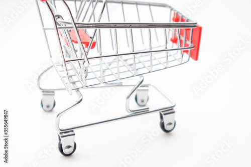Close-up of toy shopping cart on white background