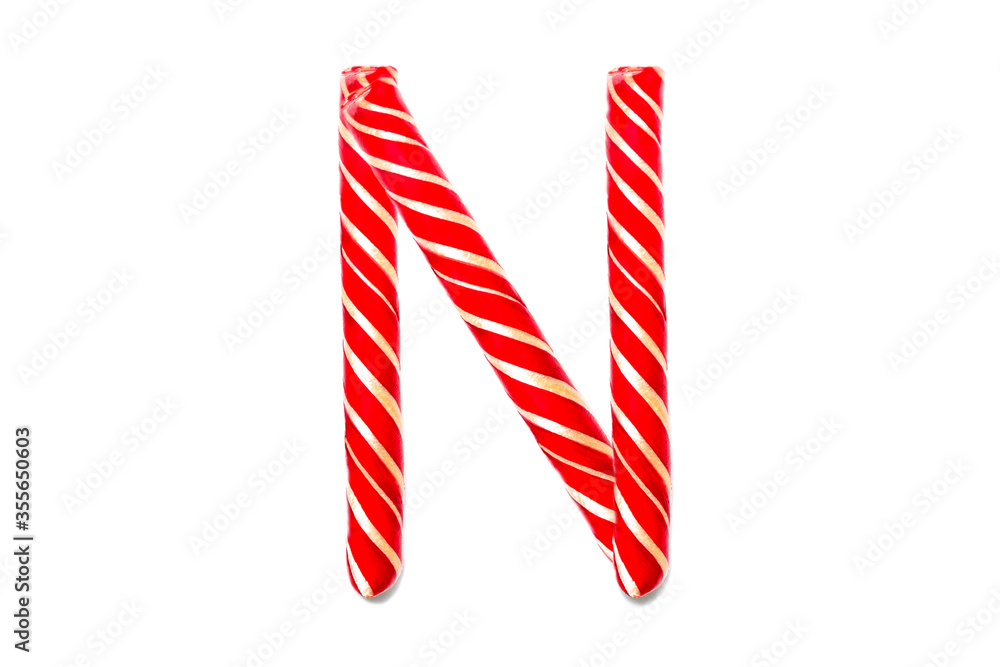 Obraz premium Christmas Candy Cane in the form of letter N. Letter N made of Red Candy Cane Isolated on White Background