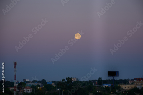 The full moon at dawn over Madrid. Spain