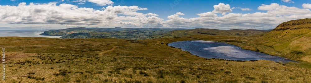 Panorama of Loughnatrosk in the Antrim hills over looking Carnlough and Glencloy, Glens of Antrim, Area of Outstanding Natural Beauty, County Antrim, Northern Ireland