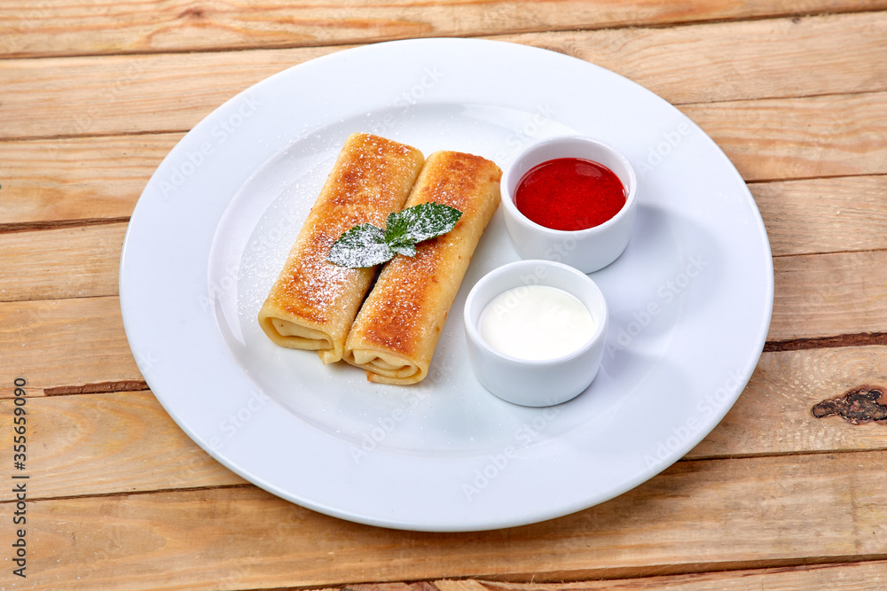 pancakes with sour cream and berry sauce pancakes with sour cream and berry sauce