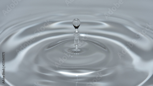 Ripples created by water drops, in the bowl.