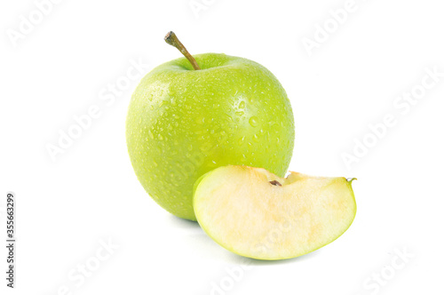 Whole green apple and sliced on white background. Fresh green apple.