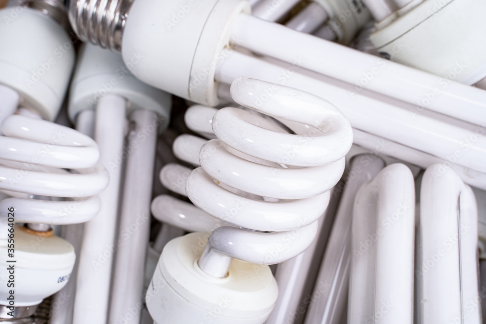 Hazardous and toxic electronic waste. A mixture of discarded light bulbs. Hazardous and toxic electronic waste. A mixture of discarded light bulbs.