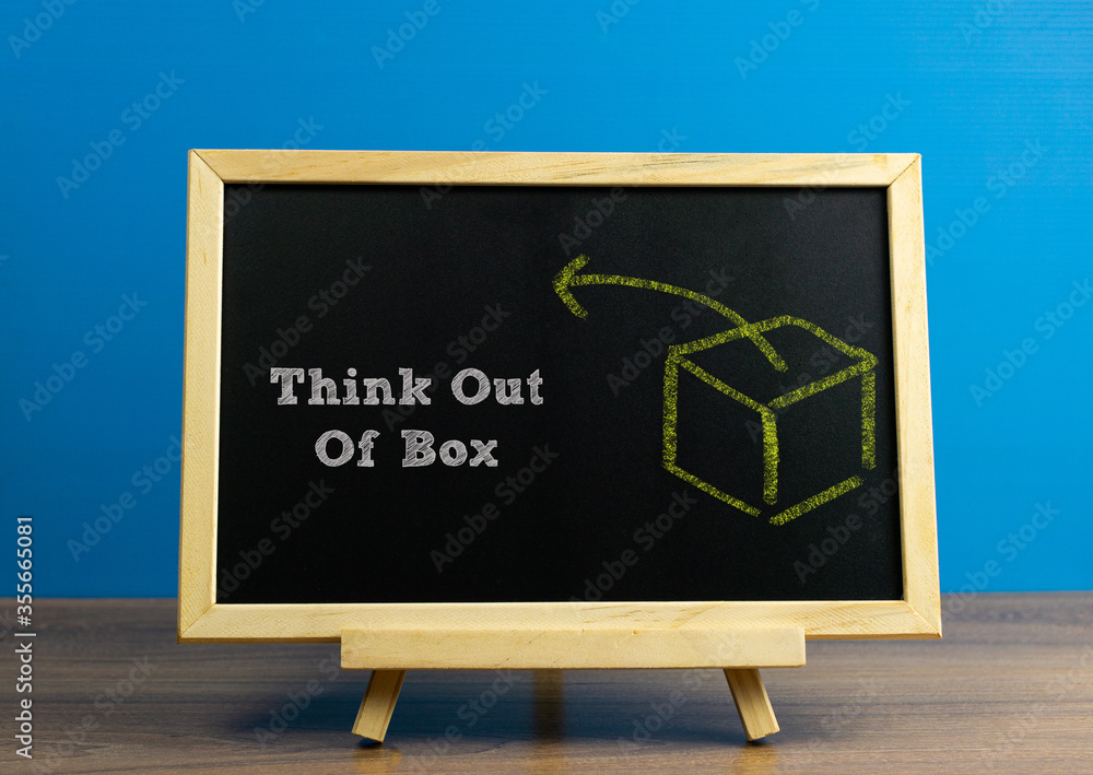 Think out of box word written on chalkboard with box drawing, conceptual