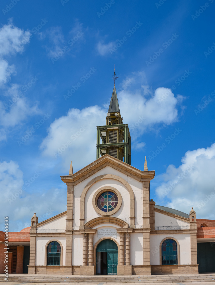 Le Francois, Martinique - September 18, 2018: Eglise catholique de Saint-Michel, Catholic Church of Saint Michael. Blue sky, white clouds. Copy space