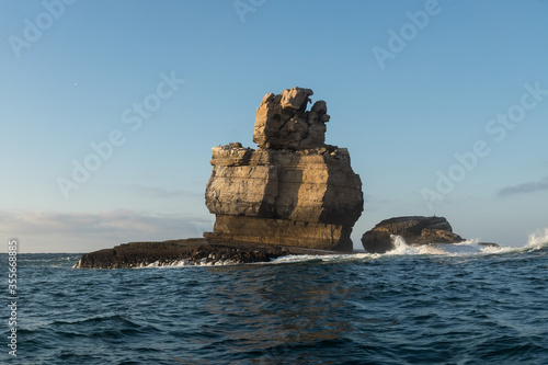 Sea stack and cliffs of Carvoeiro cape at sunset in Peniche, Atlantic coast, Portugal