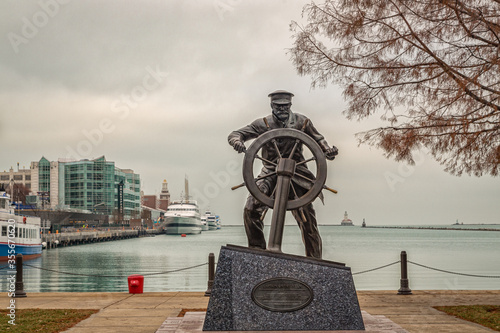 Captain on the Helm Statue, Navy Pier, Chicago, Illinois, United States of America daylight view with clouds in the sky