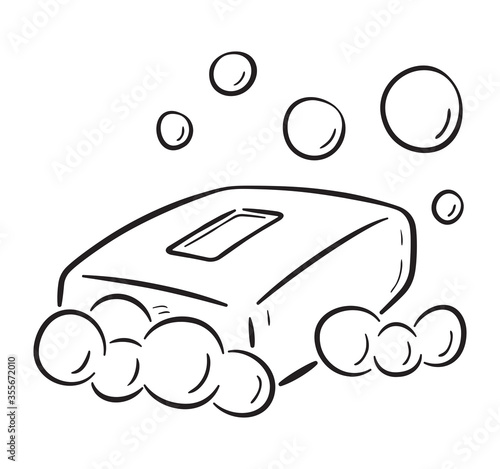 Black and white illustration of  cartoon soap bar with bubbles. On white background