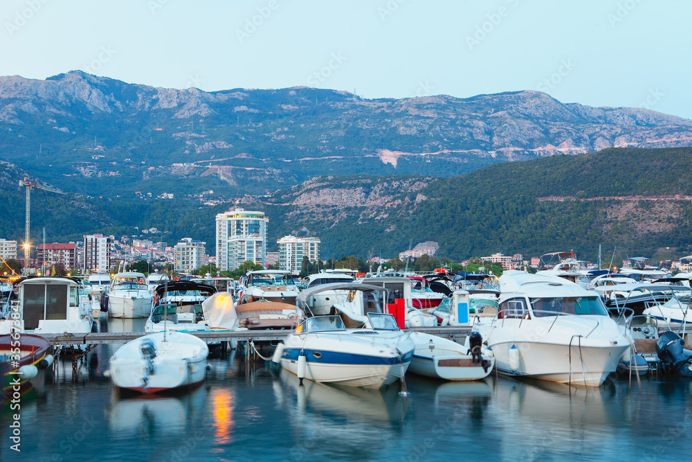 boats in harbour , scenery with nautical harbour in the evening , landscape of Budva city in Montenegro 