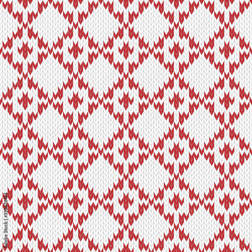 Seamless knitted pattern. Geometric ornament of diamonds in red and white colors. Christmas textile pattern