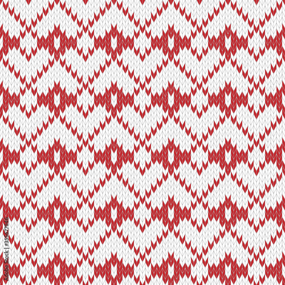 Seamless knitted pattern. Geometric ornament in red and white colors. Christmas textile pattern
