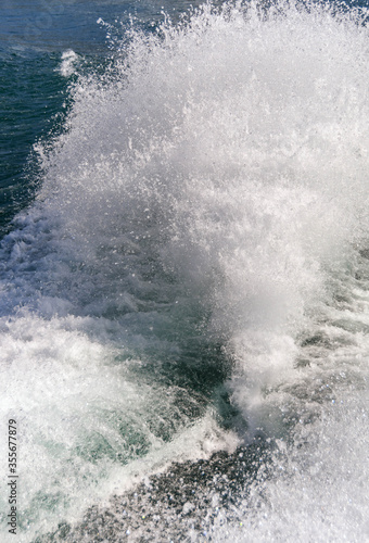 Water spray thrown up by the wake of a fast ferry