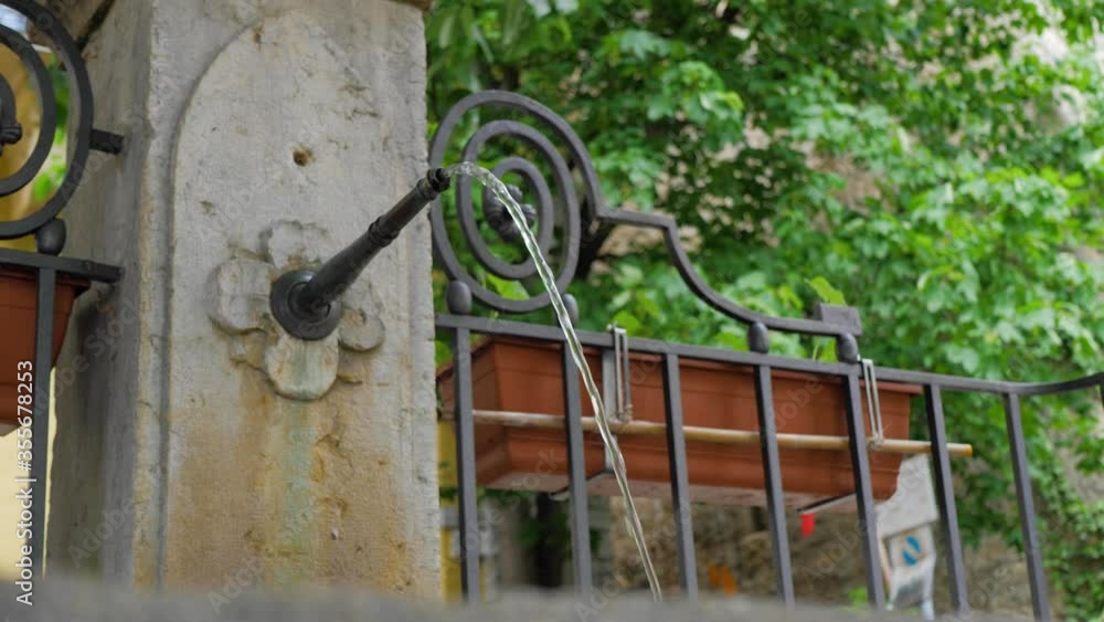 Beautiful small Fountain in a parc, old town biel-bienne city, slowmotion