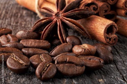 coffee beans close up on a wooden background © Mikhail