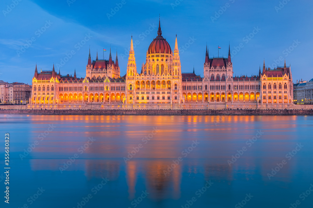 Hungarian Parliament, Budapest with reflection in Danube river during twilight