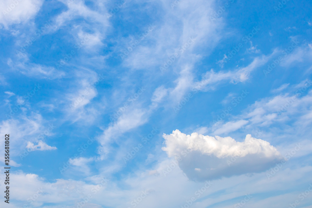 Fototapeta premium Small white cloud float on the air with blue sky on the background.