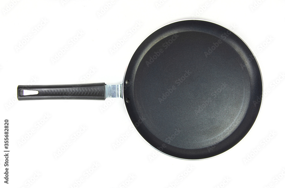 Black frying pan isolated on white background. Black frying pan isolated on white background.