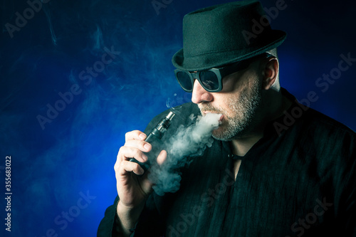Vaper. Vaping. Man smokes a...