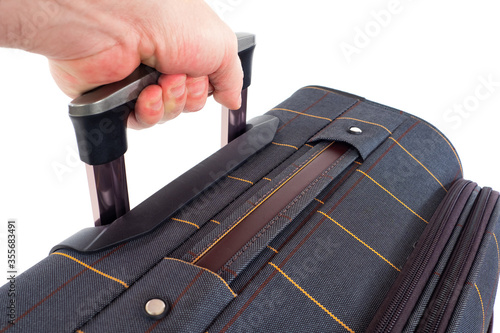 A man lifts a bag. A man pu...