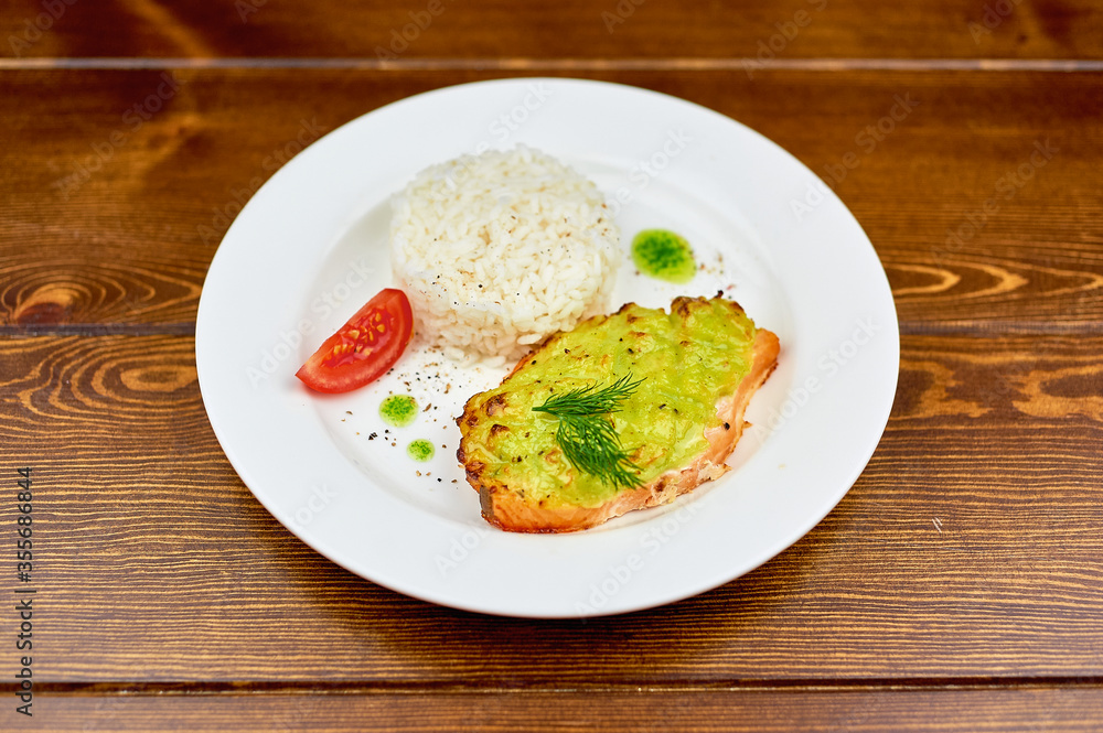 A plate of food on a wooden table A plate of food on a wooden table