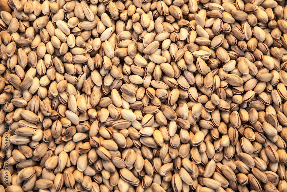 Fototapeta premium Group of fresh salted pistachios background.