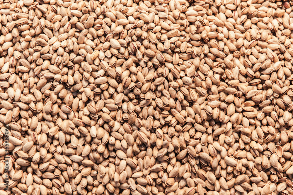 Group of fresh salted pistachios background. Group of fresh salted pistachios background.