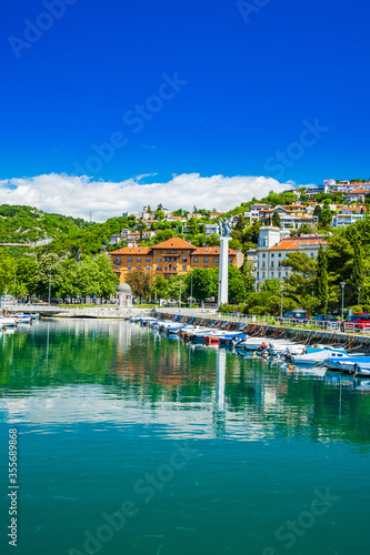 Croatia, city of Rijeka, skyline view from Delta and Rjecina river over the boats in front, colorful old buildings, monuments and Trsat on the hill in background