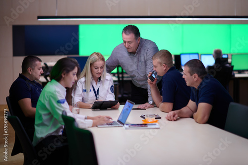 Group of security guards sitting and having briefing