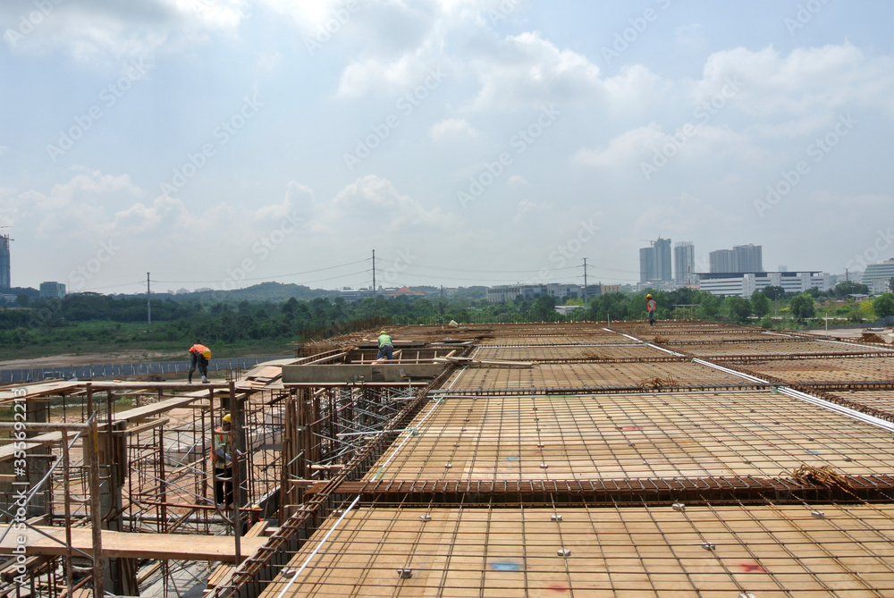 KUALA LUMPUR, MALAYSIA -MARCH 5, 2020:The construction site is operating during the day. Workers are busy carrying out their activities as planned under the supervisor's supervision.
