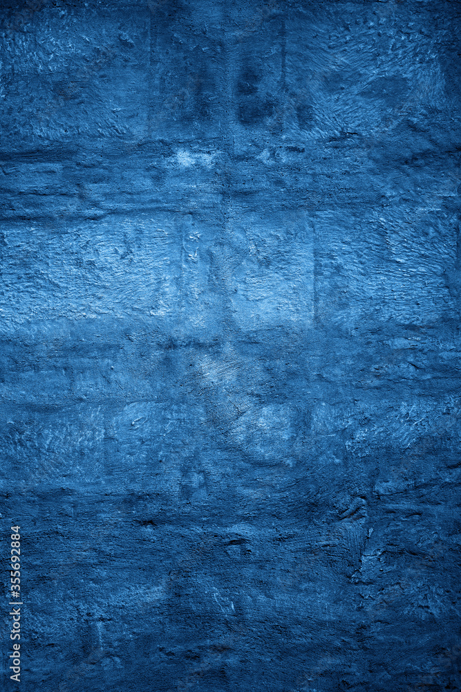 Bright blue stone wall. Marine texture background