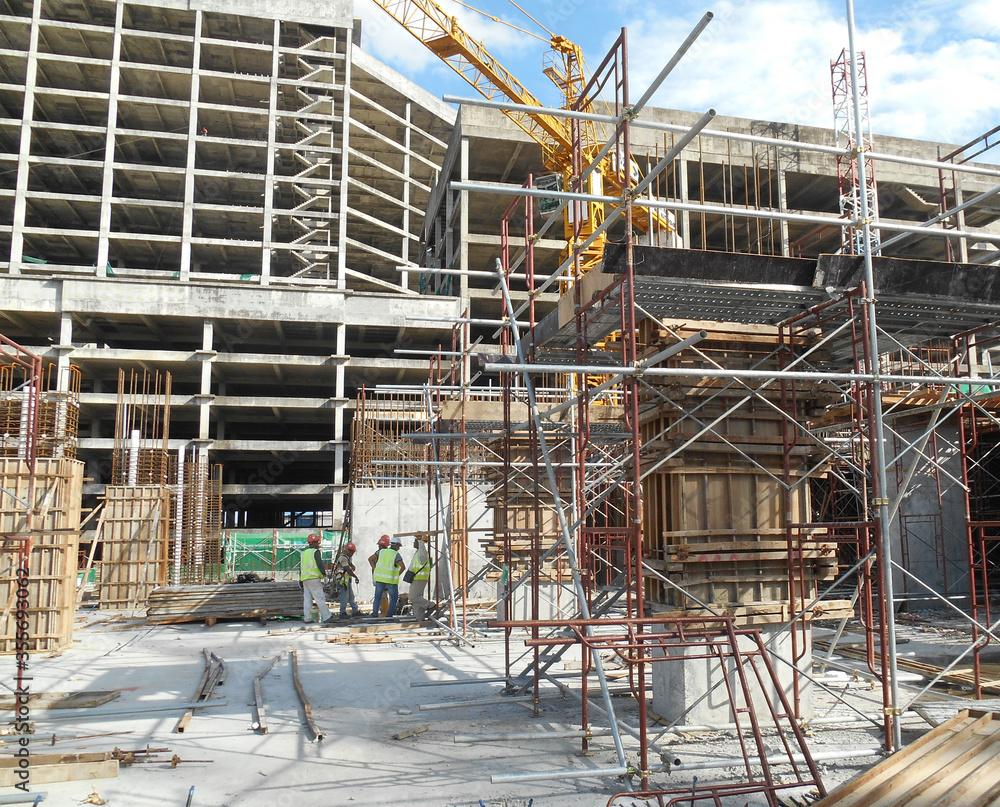 MALACCA, MALAYSIA -SEPTEMBER 19, 2016: Column timber formwork and reinforcement bar at the construction site in Malacca, Malaysia. The structure supported by temporary wood support MALACCA, MALAYSIA -SEPTEMBER 19, 2016: Column timber formwork and reinforcement bar at the construction site in Malacca, Malaysia. The structure supported by temporary wood support