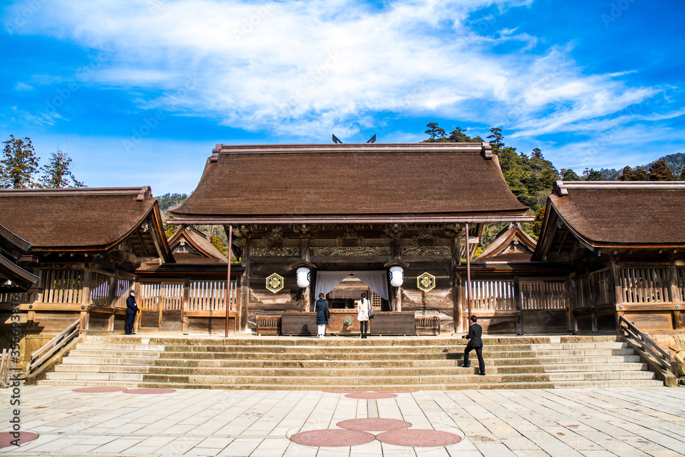 Yatsuashi gate of Izumo Taisha in Shimane, Japan. Behind which is the Honden (Main Hall) of the shrine. Yatsuashi gate of Izumo Taisha in Shimane, Japan. Behind which is the Honden (Main Hall) of the shrine.