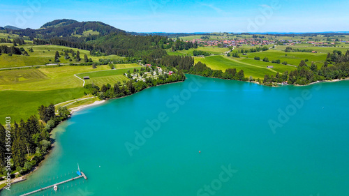 Aerial view over Lake Forggensee at the city of Fuessen in Bavaria Germany © 4kclips