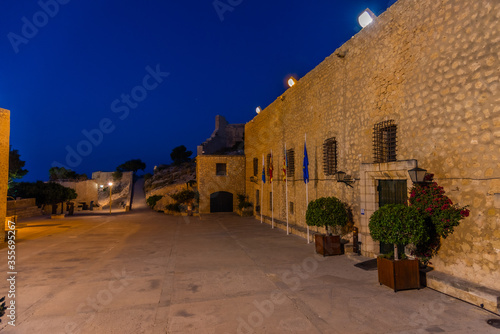 Night view of courtyard of castle of Santa Barbara in Alicante, Spain