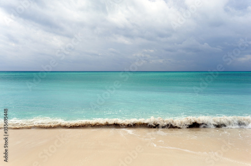 Beautiful sea wave and white sand beach Zanzibar, Tanzania. © lial88