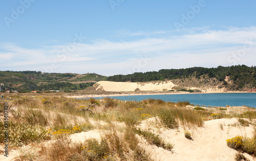 view towards the large sand dune located in Salir do Porto, on the Portuguese silver coast. the sand dune is 49 meters high 