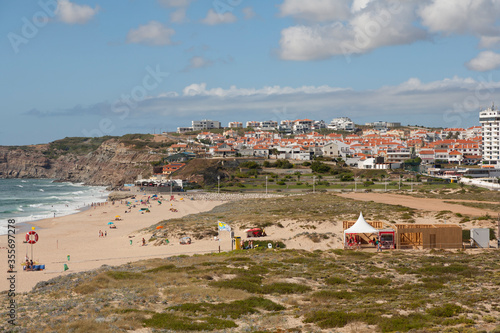 view down to the beach and town Praia da Areia Branca, near Lourinha on the Portuguese Silver Coast 