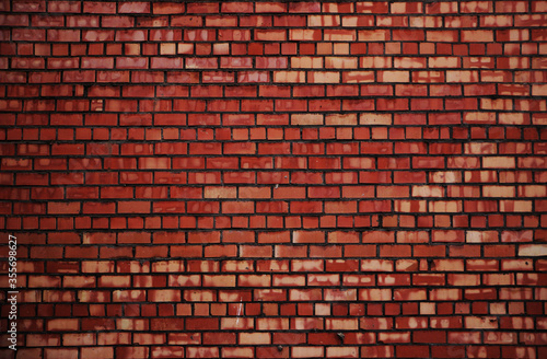 Weathered red brick wall surface background rexture photo