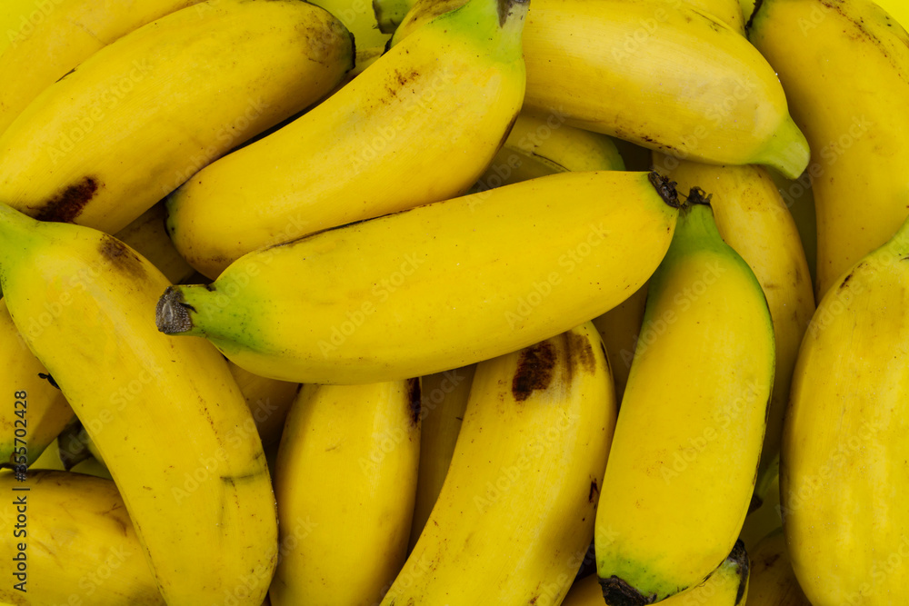 Many fresh yellow bananas as background Many fresh yellow bananas as background