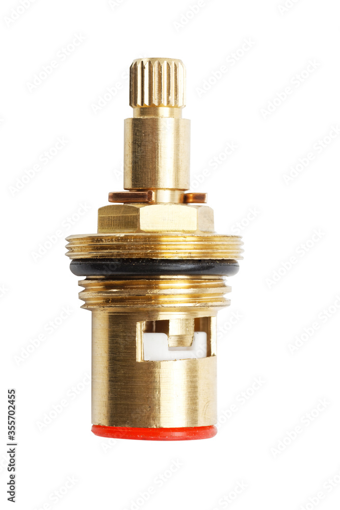 Closeup brass faucet parts cartridge for water valve isolated on white background Closeup brass faucet parts cartridge for water valve isolated on white background