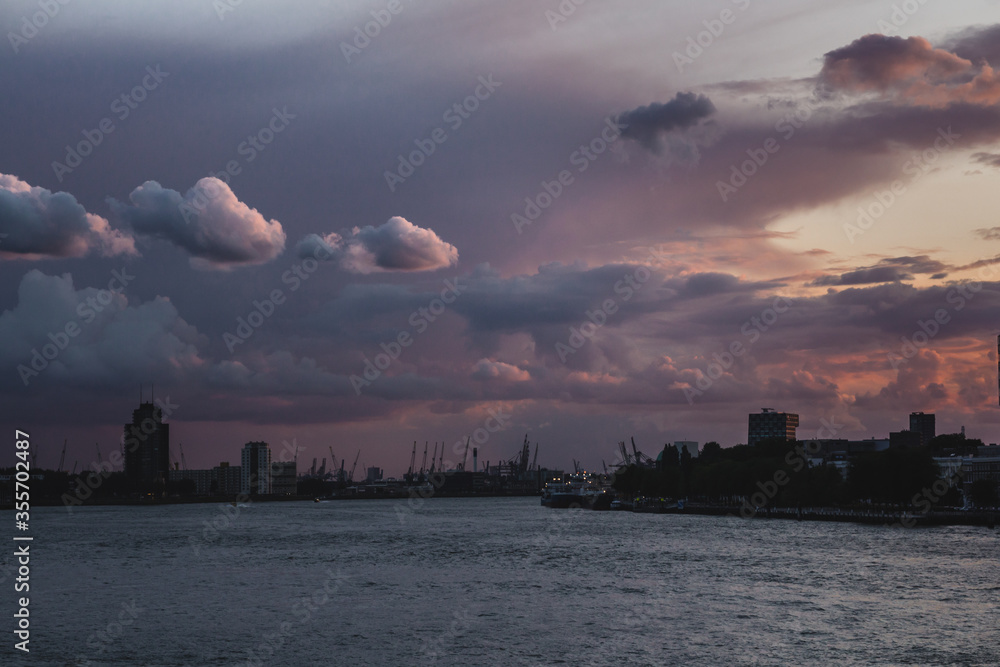 Purple sunset sky over panorama of Rotterdam